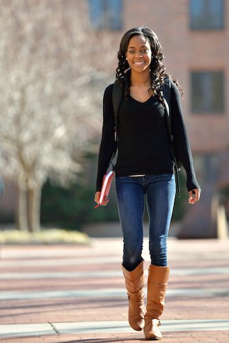 Student walking on university campus