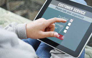Accessible Word document Person using touch tablet to rate customer service